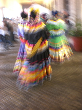 Latina women in colorful garb