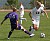 Liz Petersen dribbles past a UW-Stevens Point defender.