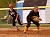 Senior Audrey Lenoch gets sets to field a bunt as a Martin Luther player leads off first base.