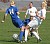 Rachel Gieseke battles a Scot for the ball.