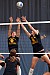 Senior Bridget Burtzel and junior Meghan Gehring go up for the block.
