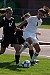 Meghan McMillan fights off two Wildcat defenders