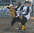Catcher Tina Strauss picks up a bunt and fires to first base in game one.