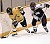 Tanna Tuomie works the puck along the boards in the first period.