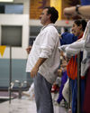 Head Coach Jon Carlson watches a race on the deck.