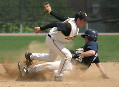 Nate Ruff tags out a Carleton base runner at second base.