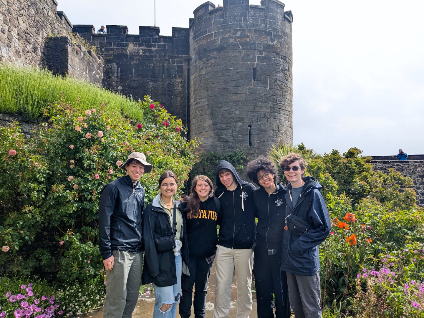 Students in front of a medieval castle.